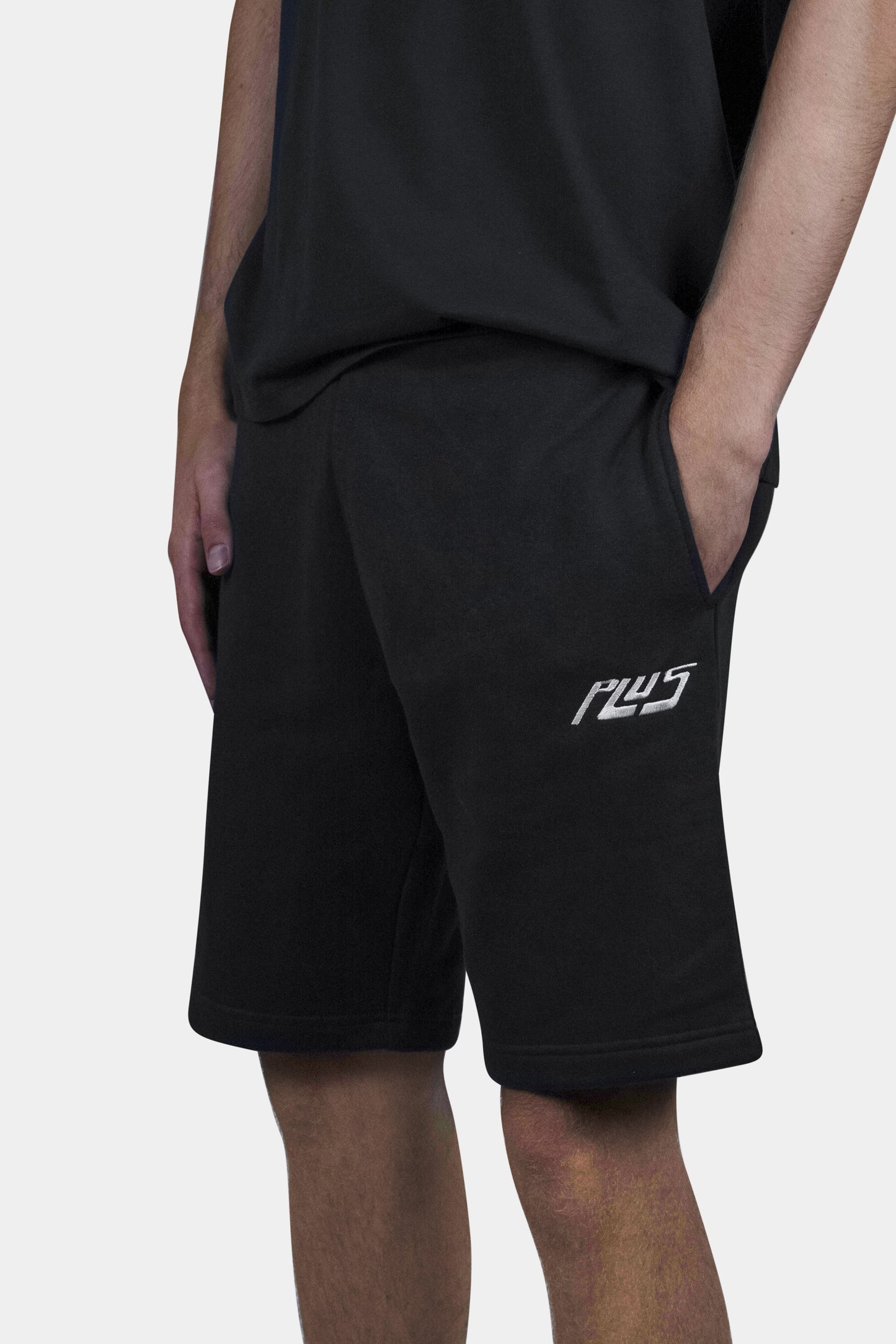 Stylish cotton blend shorts in black with deep side pockets and a relaxed fit, perfect for summer days, beach outings, and everyday comfort