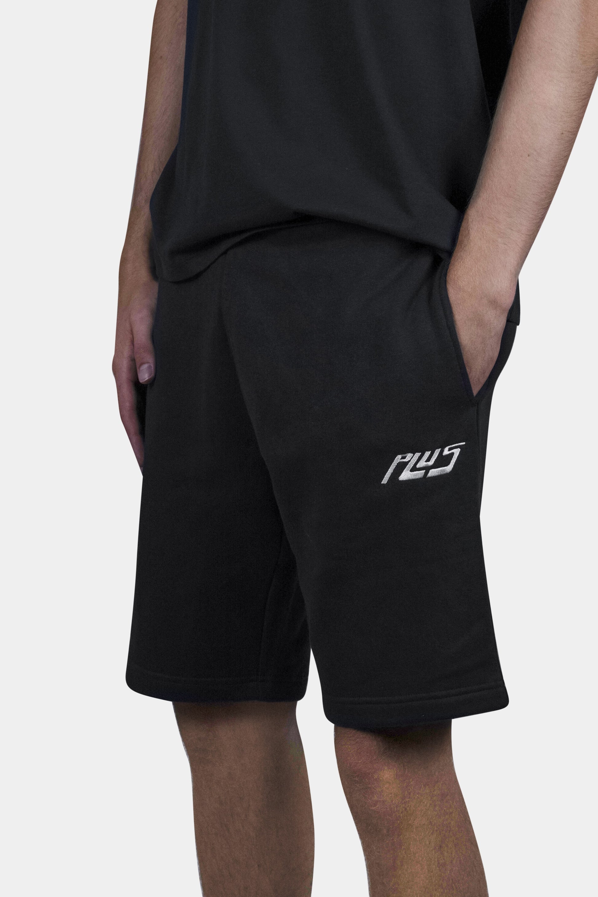 Stylish cotton blend shorts in black with deep side pockets and a relaxed fit, perfect for summer days, beach outings, and everyday comfort