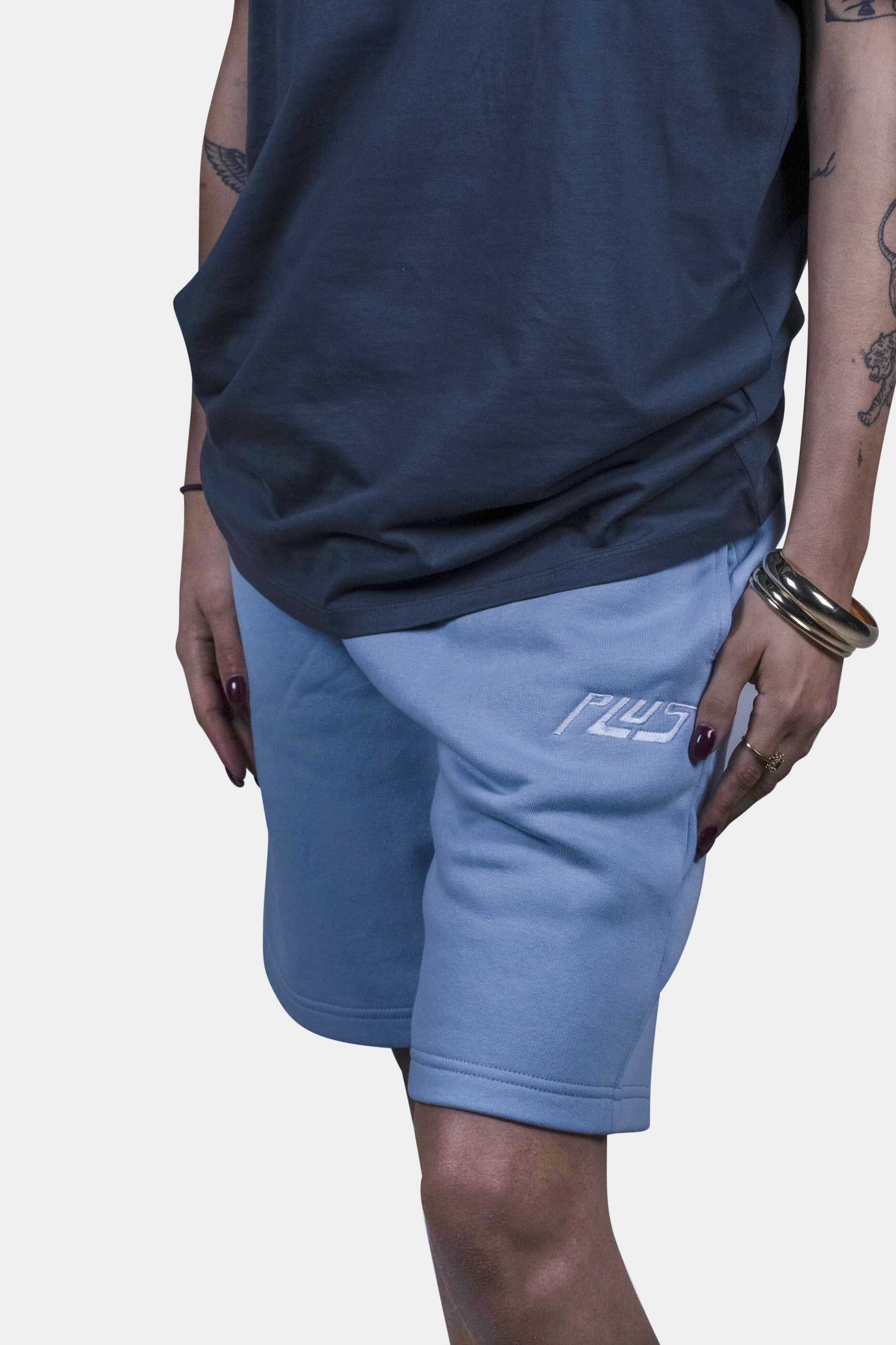 Stylish cotton blend shorts in baby blue with deep side pockets and a relaxed fit, perfect for summer days, beach outings, and everyday comfort